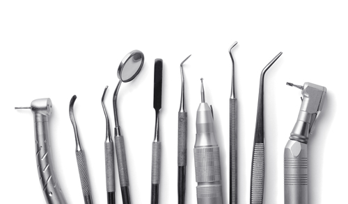 Row of various dental tools isolated on white