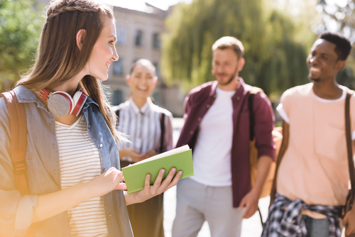 students walking together outside of campus