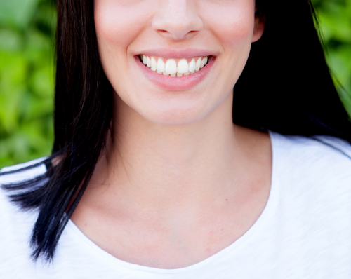 Woman showing her perfect teeth