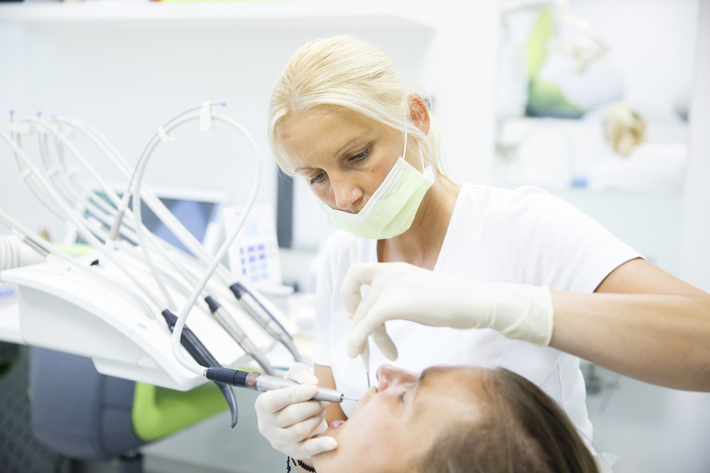 dentist treating her patient