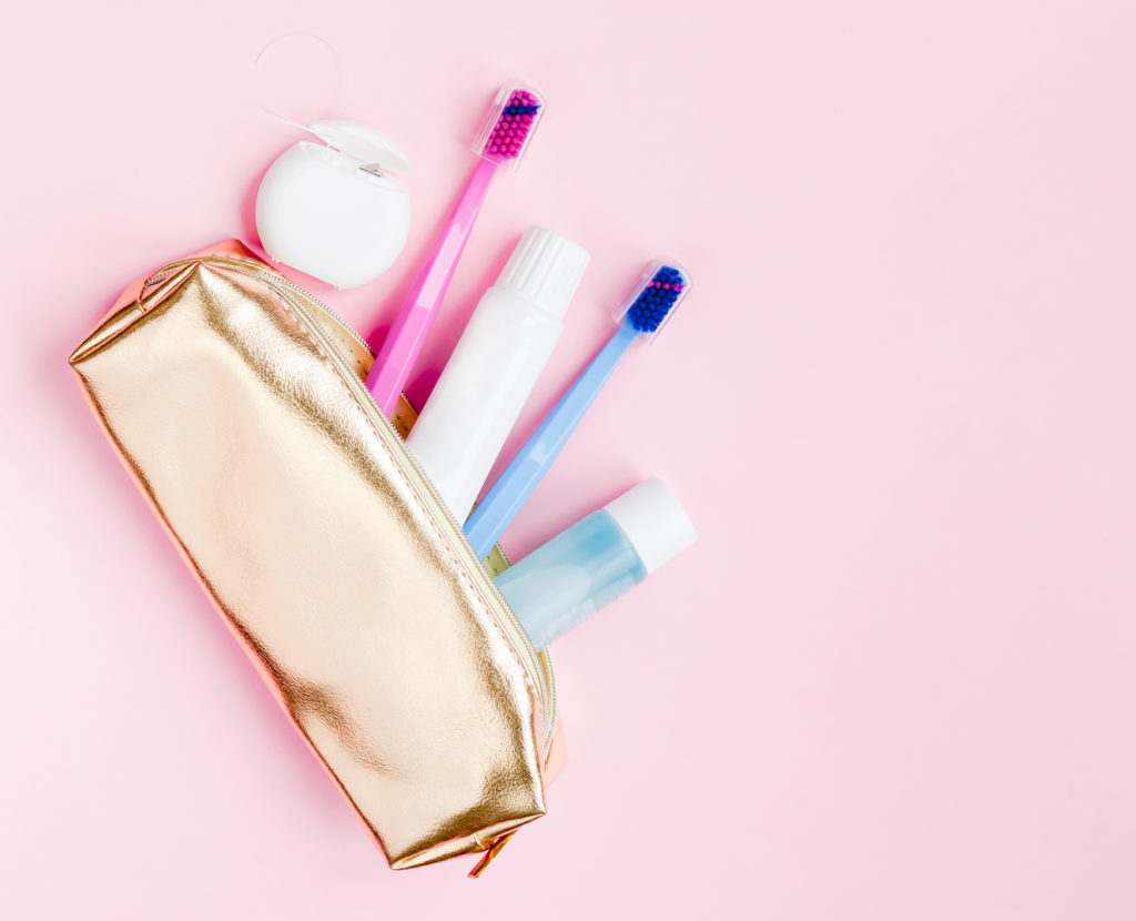 travel sized oral hygiene products in a purse