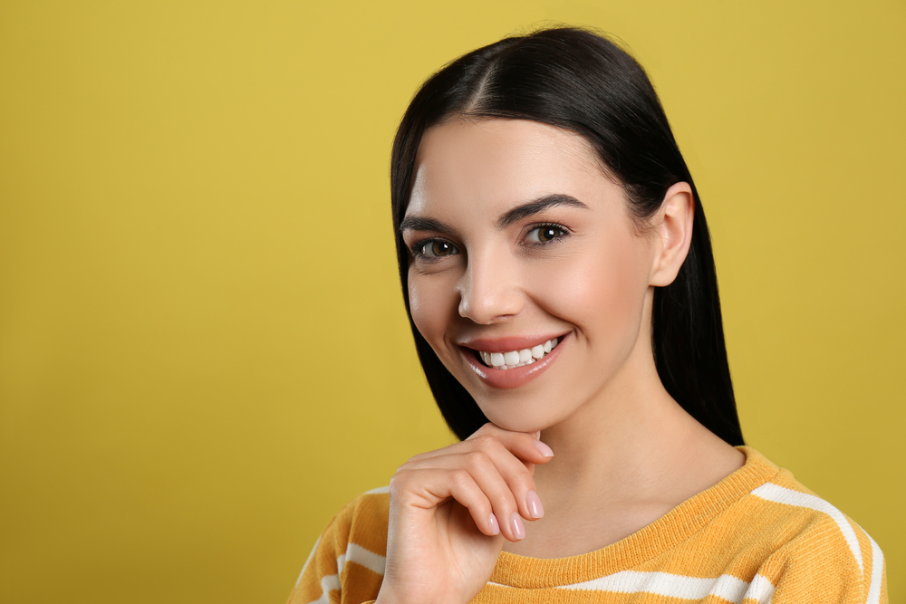 young woman smiling showing a bright smile