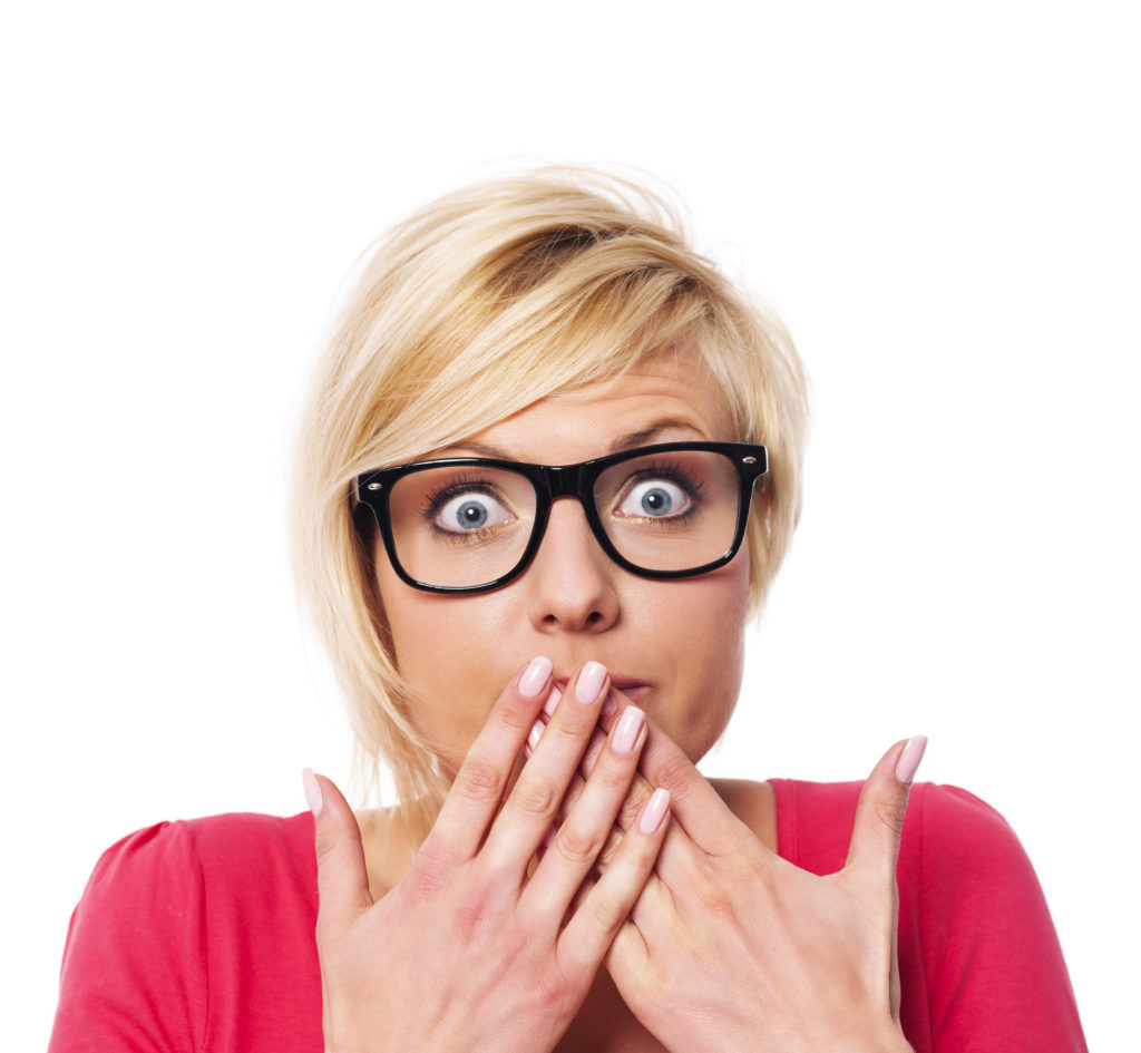 Shocked woman worried about her teeth.