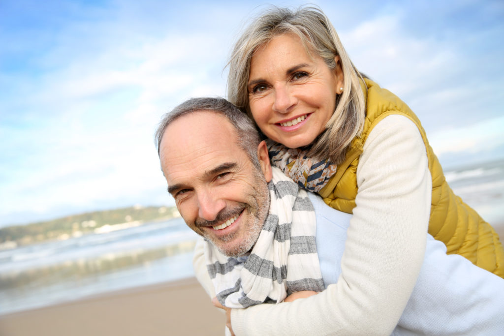 Happy couple with healthy teeth.