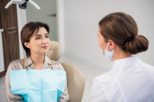 Woman with dental anxiety relaxed with sedation dentistry. 