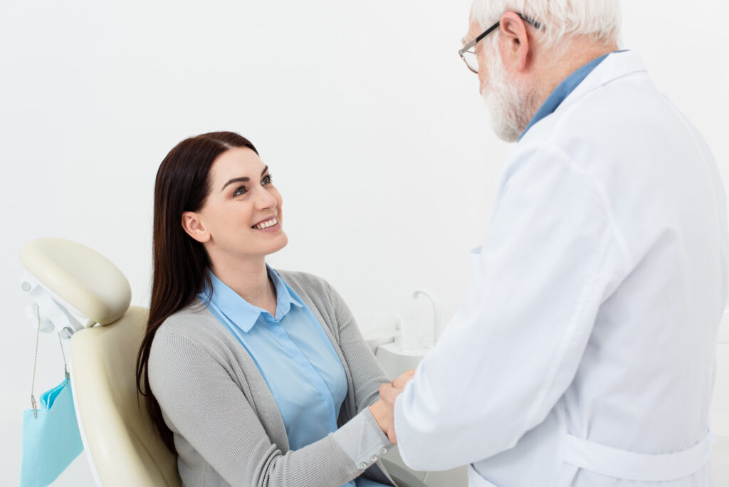 Dentist caring for patient. 