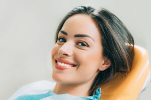 Happy woman at the dentist. 