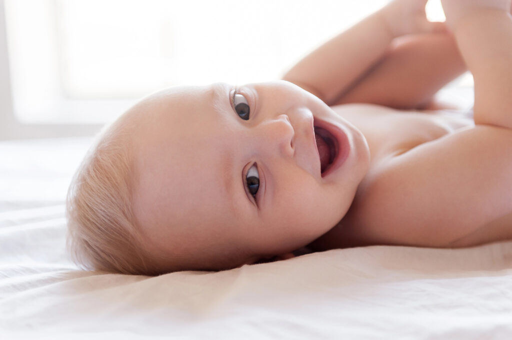 Baby with big smile.