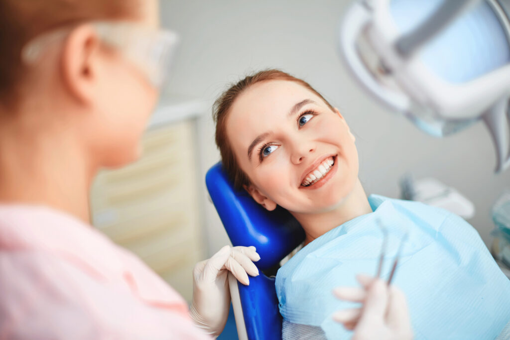 Young woman happy and comfortable at the dentist.