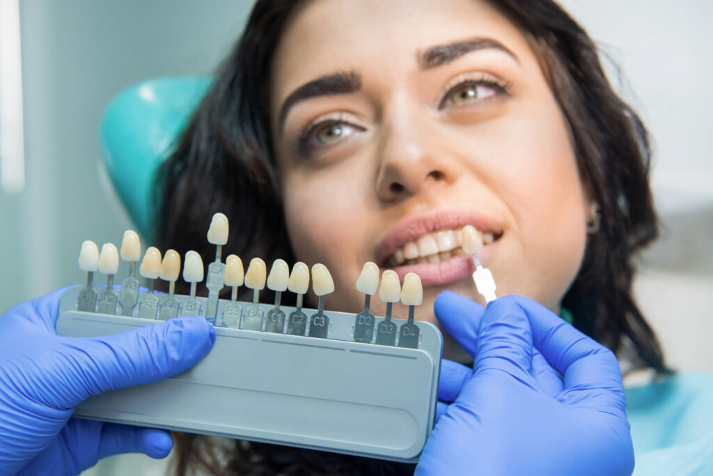 Young woman at dentist for tooth whitening.